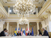 President Joe Biden speaks with Nordic leaders from left, Sweden's Prime Minister Ulf Kristersson, Denmark's Prime Minister Mette Frederiksen, Biden, Finland's President Sauli Niinisto, Iceland's Prime Minister Katrin Jakobsdottir and Norway's Prime Minister Jonas Gahr Store, at the Presidential Palace in Helsinki, Finland, Thursday, July 13, 2023.