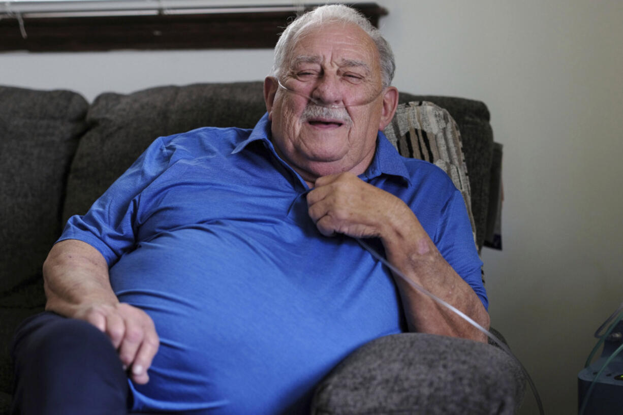 Retired coal miner James Bounds, who has pneumoconiosis, more commonly known as "black lung," poses for a photo at his home in Oak Hill, W.Va., Thursday, July, 13, 2023. Bounds said nothing can be done to reverse the debilitating illness he was diagnosed with at 37 in 1984. But he doesn't want others to suffer the same fate.