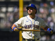 Seattle Mariners' Cal Raleigh reacts after striking out to Toronto Blue Jays relief pitcher Trevor Richards during the eighth inning of a baseball game, Sunday, July 23, 2023, in Seattle.