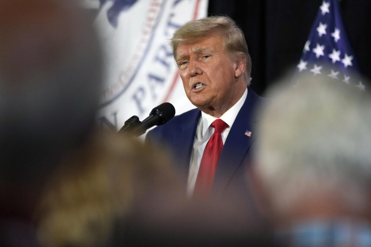 CORRECTS CITY AND LOCATION - Former President Donald Trump visits with campaign volunteers at the Elks Lodge, Tuesday, July 18, 2023, in Cedar Rapids, Iowa.