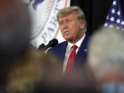 CORRECTS CITY AND LOCATION - Former President Donald Trump visits with campaign volunteers at the Elks Lodge, Tuesday, July 18, 2023, in Cedar Rapids, Iowa.