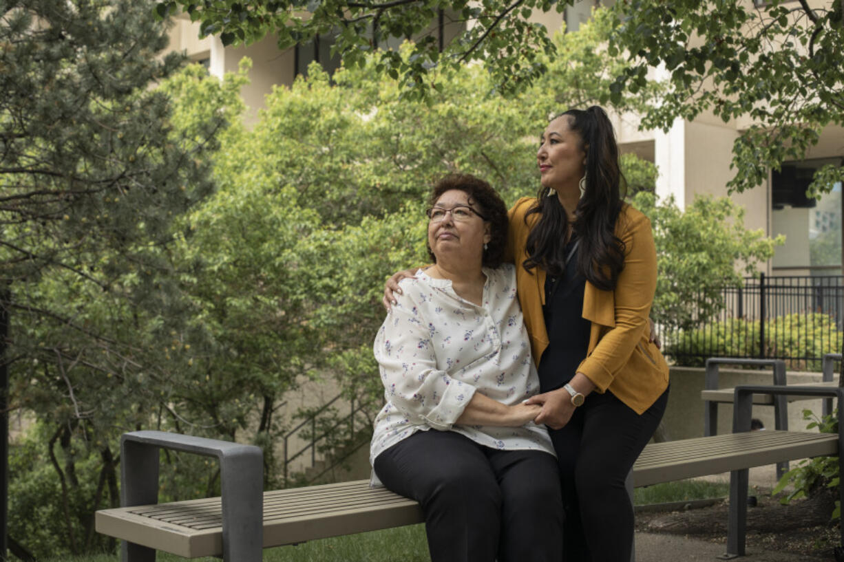 May Sarah Cardinal and her daughter, Anita Cardinal, sit for a portrait outside the Law Courts building in Edmonton, Alberta, Canada on May 25. "My mother had always told me she wanted more children but that she didn't have a choice," Anita says.