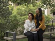 May Sarah Cardinal and her daughter, Anita Cardinal, sit for a portrait outside the Law Courts building in Edmonton, Alberta, Canada on May 25. "My mother had always told me she wanted more children but that she didn't have a choice," Anita says.