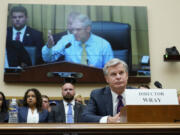 FILE - FBI Director Christopher Wray listens as Rep. Jim Jordan, R-Ohio, chair of the House Committee on the Judiciary, speaks during an oversight hearing, Wednesday, July 12, 2023, on Capitol Hill in Washington. Wray appeared before the House Judiciary Committee for the first time since Republicans took control in January.