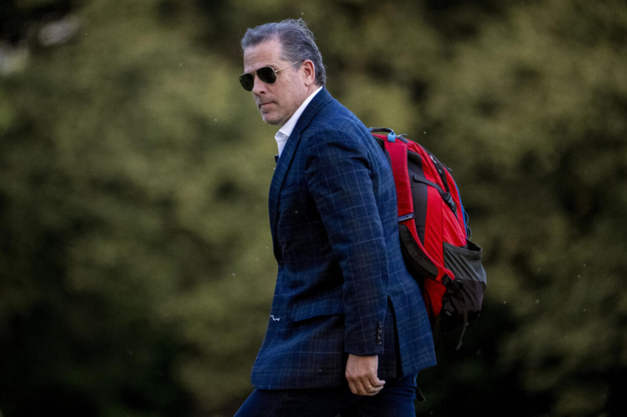 FILE - Hunter Biden, the son of President Joe Biden, walks from Marine One upon arrival at Fort McNair, June 25, 2023, in Washington. The Republican chairmen of three key House committees are joining forces to probe the Justice Department's handling of charges against Hunter Biden after making sweeping claims about misconduct at the agency.