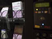 A vending machine is stocked with emergency contraceptives at Odegaard Library on the campus of the University of Washington, Friday, June 2, 2023, in Seattle.  After a student-led campaign to install the emergency contraceptive vending machine on campus in November, boxes of generic Plan B have been available to students for $12.60, a fraction of the cost charged in stores.