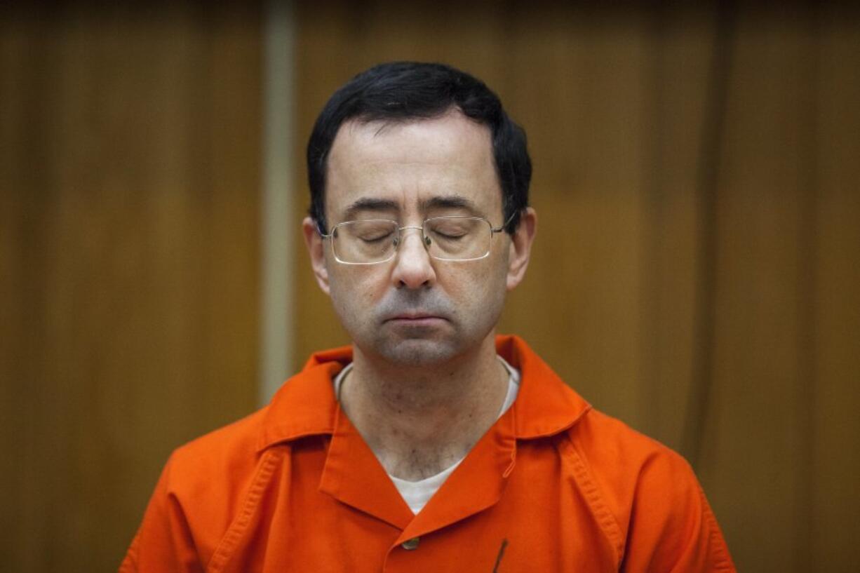 FILE - Larry Nassar listens during his sentencing at Eaton County Circuit Court in Charlotte, Mich., Feb. 5, 2018. Nassar, who was convicted of sexually abusing female gymnasts including Olympic medalists, was stabbed multiple times during an altercation with another inmate at a federal prison in Florida on Sunday, July 9, 2023.