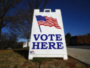 FILE - A vote here sign is seen outside a polling place during the South Carolina primary, Saturday, Feb. 29, 2020, in Columbia, S.C. Months after the Democratic Party approved President Joe Biden's plan to overhaul its primary order to better reflect a deeply diverse voter base, implementing the revamped order has proven anything but simple. Party officials now expect the process to continue through the end of the year -- even as the 2024 presidential race heats up all around it.