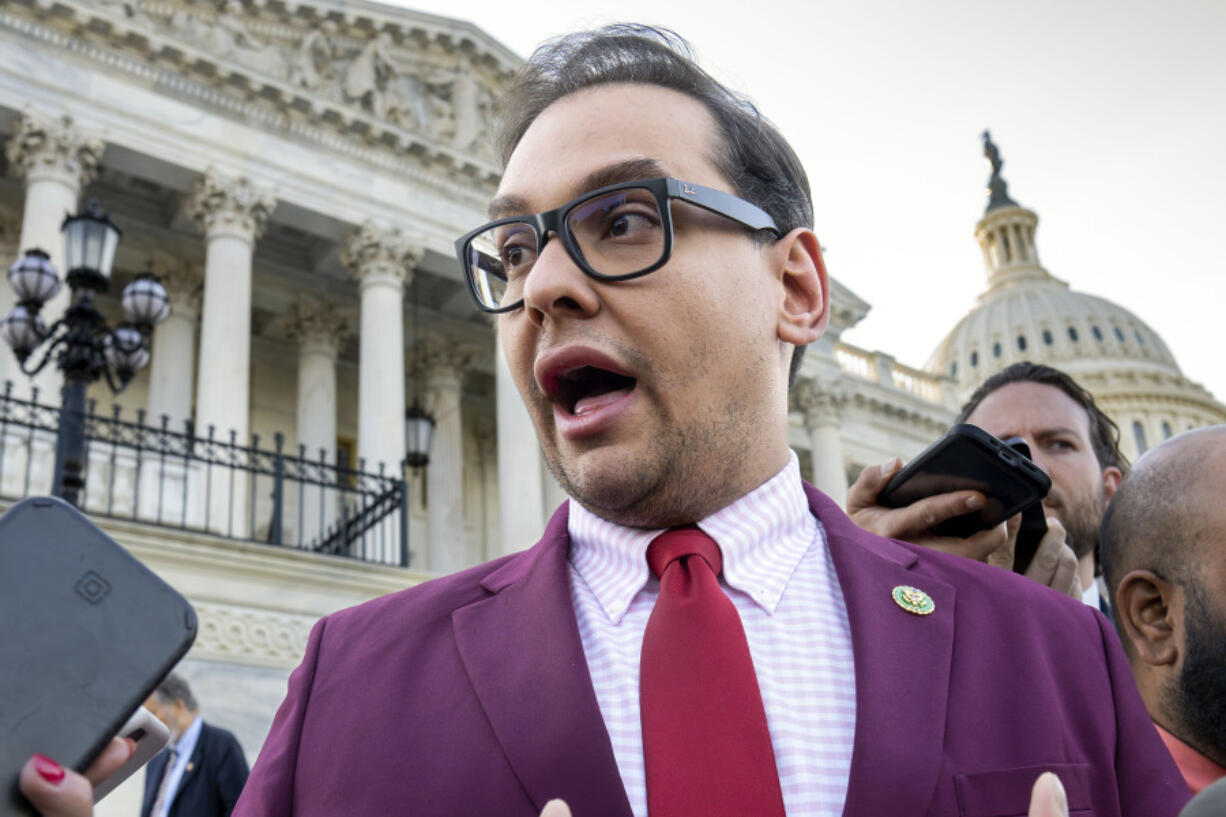 FILE - U.S. Rep. George Santos, R-N.Y., speaks to reporters outside the Capitol, in Washington, May 17, 2023. Santos, charged with a host of financial crimes, including embezzling money from his campaign, withdrew $85,000 from his campaign to help repay hundreds of thousands of dollars he loaned himself to get elected in 2022. (AP Photo/J.