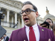 FILE - U.S. Rep. George Santos, R-N.Y., speaks to reporters outside the Capitol, in Washington, May 17, 2023. Santos, charged with a host of financial crimes, including embezzling money from his campaign, withdrew $85,000 from his campaign to help repay hundreds of thousands of dollars he loaned himself to get elected in 2022. (AP Photo/J.