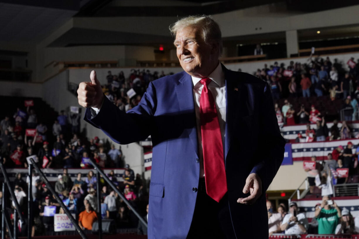 Republican presidential candidate and former President Donald Trump gestures as he leaves a campaign rally, Saturday, July 29, 2023, in Erie, Pa.