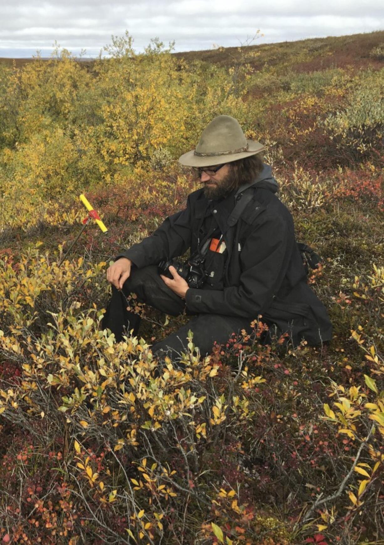 This photo taken on Aug. 23, 2016, shows scientist Ronald Daanen conducting field work north of Fairbanks, Alaska. Daanen was among three state workers and the pilot who died when their helicopter crashed on July 20, 2023, on Alaska's North Slope.