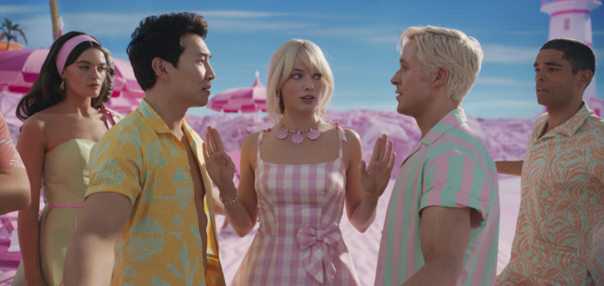 This mage released by Warner Bros. Pictures shows, from left, Emma Mackey, Simu Liu, Margot Robbie, Ryan Gosling and Kingsley Ben-Adir in a scene from "Barbie." (Warner Bros.