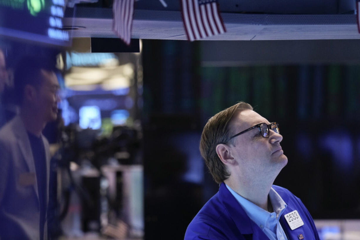 Traders work on the floor at the New York Stock Exchange in New York, Wednesday, July 26, 2023. Stocks are opening mixed as Wall Street waits to hear what the Federal Reserve will do with interest rates later in the afternoon.