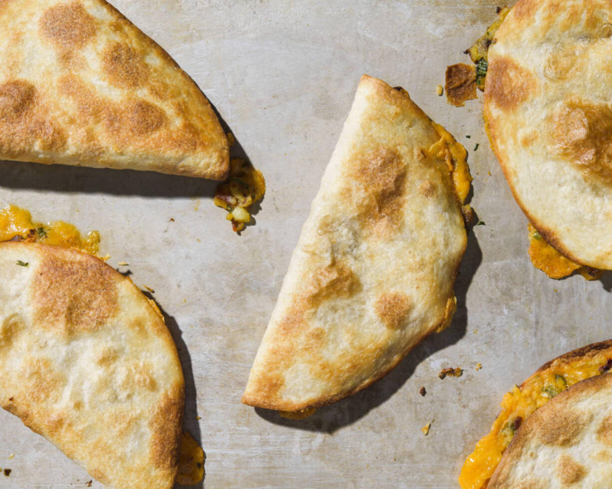 Oven-fried potato and cheese tacos dorados.