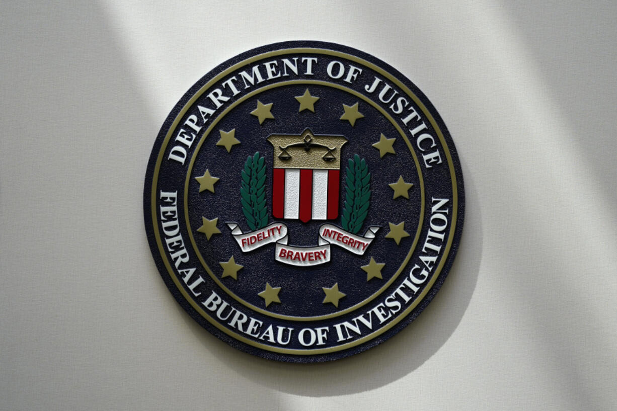 FILE - The FBI seal is pictured in Omaha, Neb., Aug. 10, 2022. A White House advisory board is calling for major changes in how the FBI uses a controversial foreign surveillance tool. The President's Intelligence Advisory Board issued a report Monday, July 31, 2023, with new recommendations related to Section 702 of the Foreign Intelligence Surveillance Act.