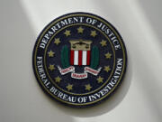 FILE - The FBI seal is pictured in Omaha, Neb., Aug. 10, 2022. A White House advisory board is calling for major changes in how the FBI uses a controversial foreign surveillance tool. The President's Intelligence Advisory Board issued a report Monday, July 31, 2023, with new recommendations related to Section 702 of the Foreign Intelligence Surveillance Act.