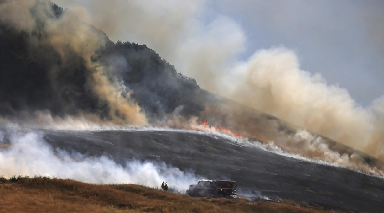 The San Antonio Fire spreads uphill west of Petaluma, Ca., Friday, June 30, 2023. The entire planet sweltered for the two unofficial hottest days in human recordkeeping Monday and Tuesday, according to University of Maine scientists at the Climate Reanalyzer project. The unofficial heat records come after months of unusually hot conditions due to climate change and a strong El Nino event.