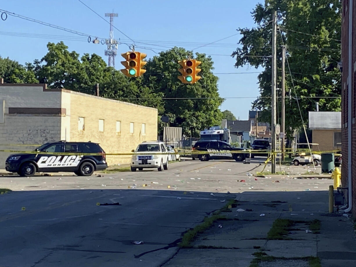 Police remain at the scene of a shooting on Sunday, July 30, 2023 in Muncie, Ind. Police said in a news release that there was no active threat to the community and that "multiple" victims were injured, including some critically.