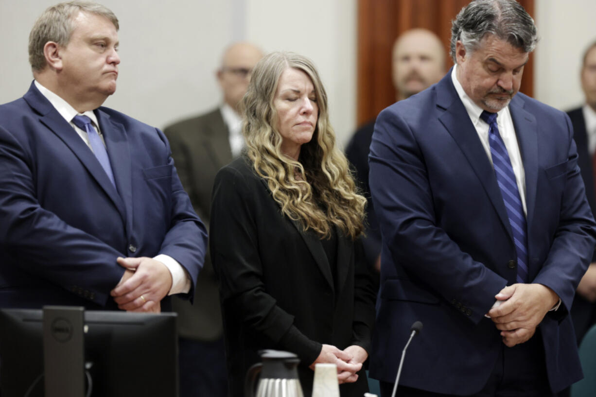 FILE - Lori Vallow Daybell stands and listens as the jury's verdict is read at the Ada County Courthouse in Boise, Idaho on Friday, May 12, 2023. Vallow Daybell faces up to life in prison without parole when she is expected to be sentenced Monday, July 31, in the murders of her two youngest children and a romantic rival.