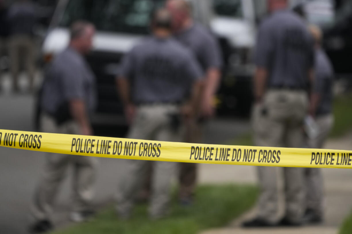 Authorities continue to work at the home of suspect Rex Heuermann in Massapequa Park, N.Y., Monday, July 24, 2023. Heuermann has been charged with killing at least three women in the long-unsolved slayings known as the Gilgo Beach killings.