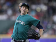 Seattle Mariners starting pitcher Logan Gilbert delivers during the first inning of a baseball game against the Houston Astros, Sunday, July 9, 2023, in Houston. (AP Photo/ (Kevin M.