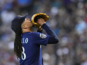 Seattle Mariners starting pitcher Luis Castillo looks skyward after retiring the Arizona Diamondbacks during the first inning of a baseball game Sunday, July 30, 2023, in Phoenix. (AP Photo/Ross D.