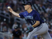 Seattle Mariners relief pitcher Paul Sewald throws to the Minnesota Twins in the 10th inning of a baseball game Monday, July 24, 2023, in Minneapolis.