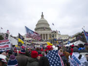 FILE - Rioters loyal to President Donald Trump rally at the U.S. Capitol in Washington on Jan. 6, 2021. Federal prosecutors say Taylor Taranto, 37, who prosecutors say participated in the Jan. 6, 2021 riot at the U.S. Capitol and arrested last week near the home of former President Barack Obama, told followers on his YouTube live stream that he was looking to get a "good angle on a shot" and that he was trying to locate the "tunnels underneath their houses" shortly before he was taken into custody by the Secret Service.