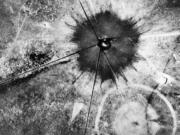 FILE - This July 16, 1945, photo shows an aerial view after the first atomic explosion at Trinity Test Site, N.M. U.S. senators from New Mexico and Idaho are making another push to expand the federal government's compensation program for people exposed to radiation following uranium mining and nuclear testing carried out during the Cold War. Downwinders who live near the site where the world's first atomic bomb was tested in 1945 as part of the top secret Manhattan Project would be among those added to the list.