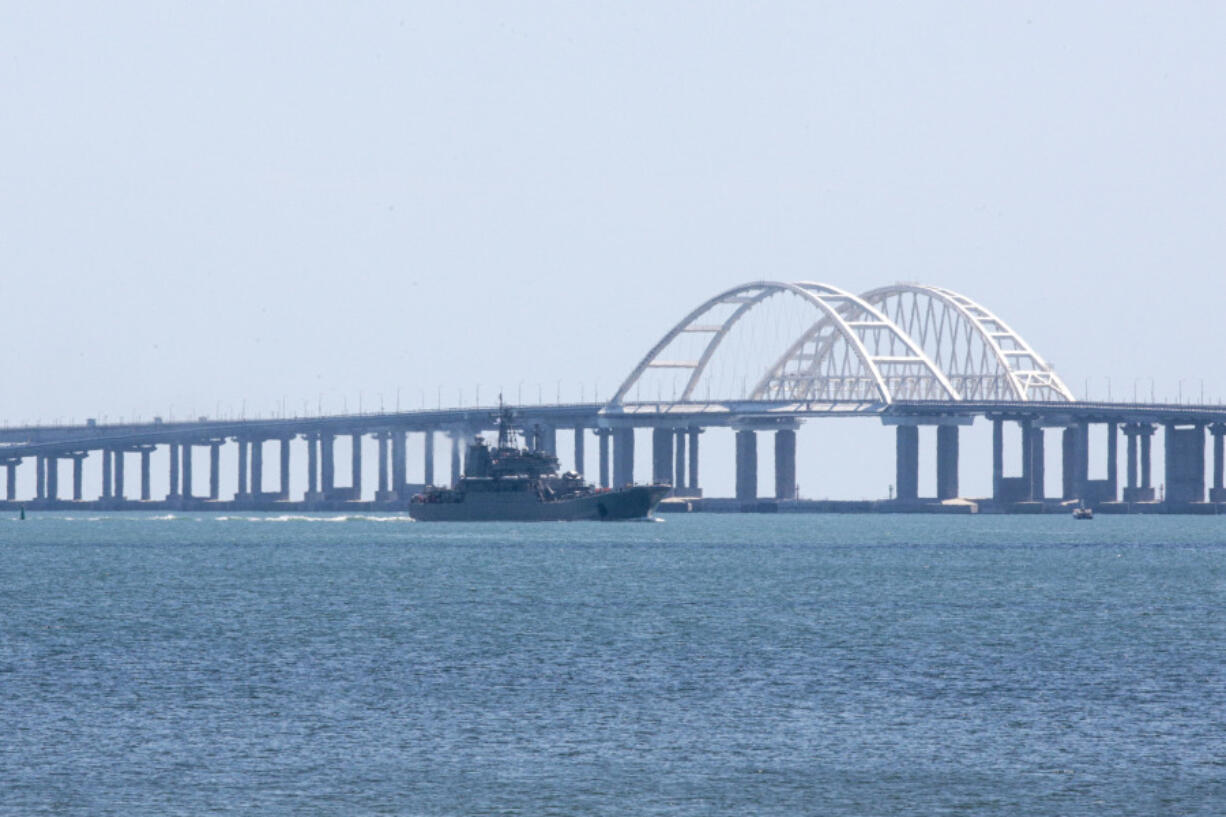 A Russian military large landing ship, which now transports cars and people between Crimea and Taman due to the Crimean Bridge connecting Russian mainland and Crimean peninsula over the Kerch Strait being closed, sails, near Kerch, Crimea, on Monday, July 17, 2023. An attack before dawn damaged part of a bridge linking Russia to Moscow-annexed Crimea that is a key supply route for Kremlin forces in the war with Ukraine. The strike Monday has forced the span's temporary closure for a second time in less than a year.