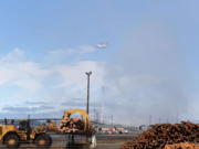 A helicopter pulls water from the Columbia River to dump on the Nippon Dynawave Packaging fire on Thursday, July 20, in Longview. Despite a haze and smell of smoke, Longview’s air quality remained “good” Thursday morning, according to the Southwest Clean Air Agency.