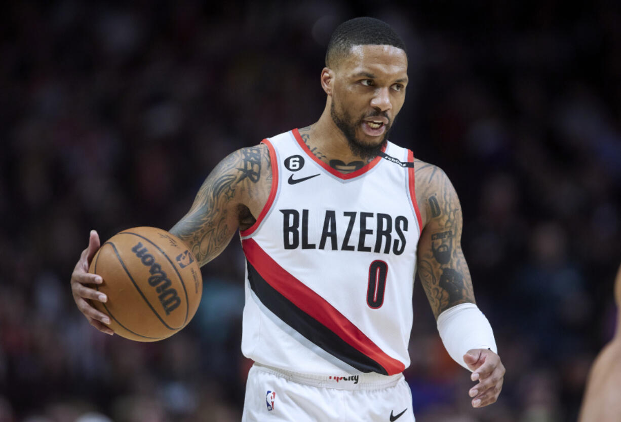 FILE - Portland Trail Blazers guard Damian Lillard brings the ball up against the New York Knicks during the second half of an NBA basketball game in Portland, Ore., Tuesday, March 14, 2023.