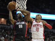 Houston Rockets' Jabari Smith Jr., right, fouls Portland Trail Blazers' Scoot Henderson during the second half of an NBA summer league basketball game Friday, July 7, 2023, in Las Vegas.