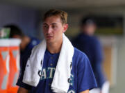 Seattle Mariners starting pitcher George Kirby walks in the dugout after pitching through seven innings of a baseball game against the Minnesota Twins, Thursday, July 20, 2023, in Seattle.