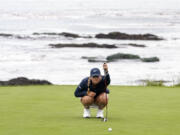 Bailey Tardy measure her putt on the ninth green during the second round of the U.S. Women's Open golf tournament at the Pebble Beach Golf Links, Friday, July 7, 2023, in Pebble Beach, Calif.