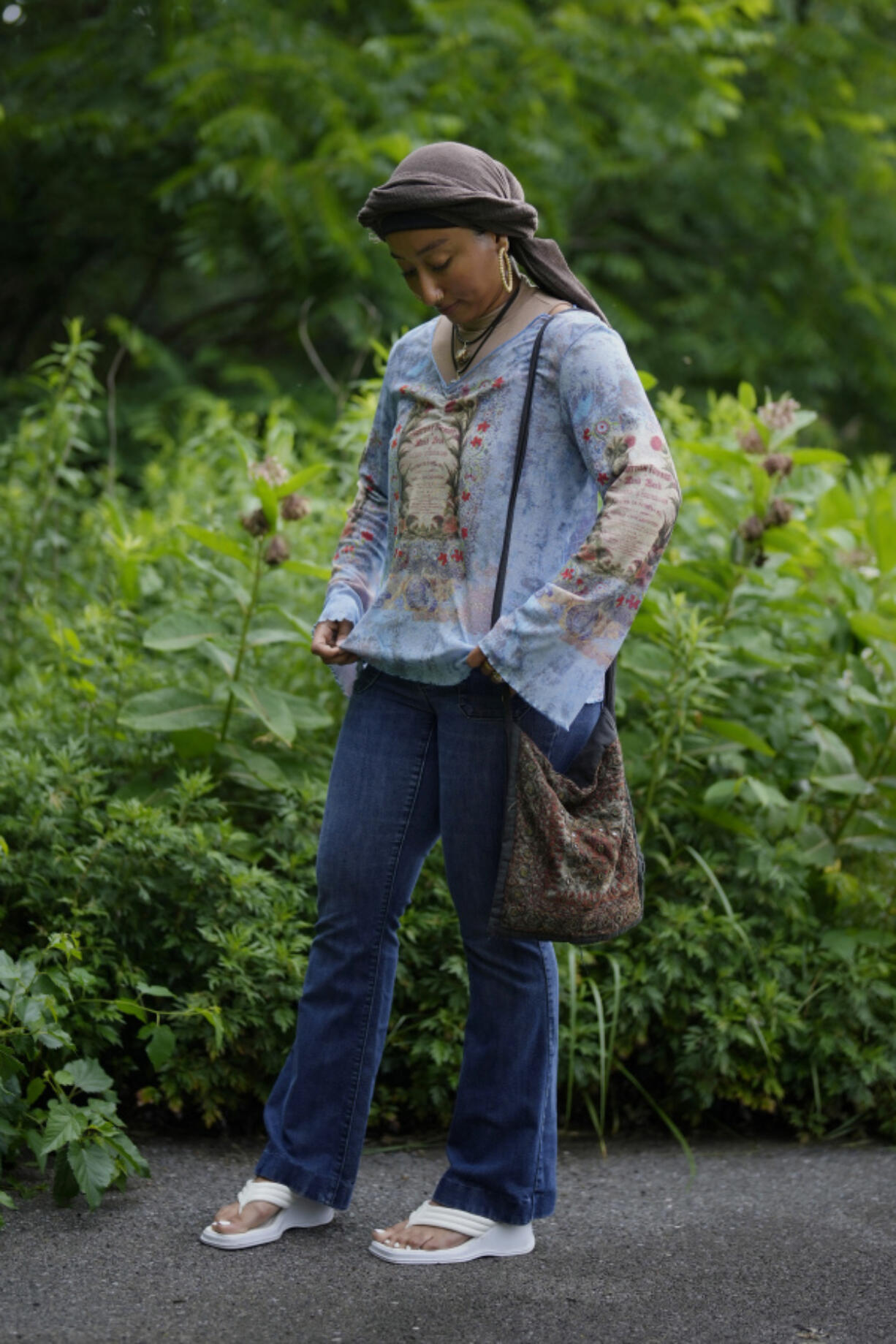 Yasmeen Bekhit adjusts her Y2K-inspired outfit near her home in Manheim, Pa.