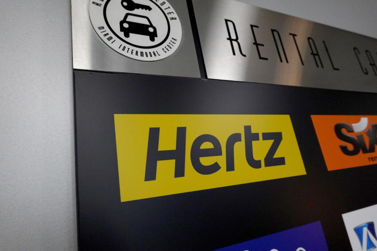 A Hertz car rental sign in the Miami International Airport on Oct. 25, 2021, in Miami.