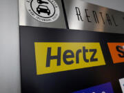 A Hertz car rental sign in the Miami International Airport on Oct. 25, 2021, in Miami.