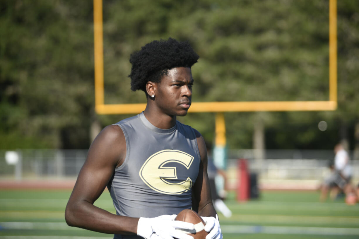 Arthur Ban of Evergreen High School goes through drills during a summer workout.