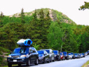 Cars line up to visit Acadia National Park in Maine.