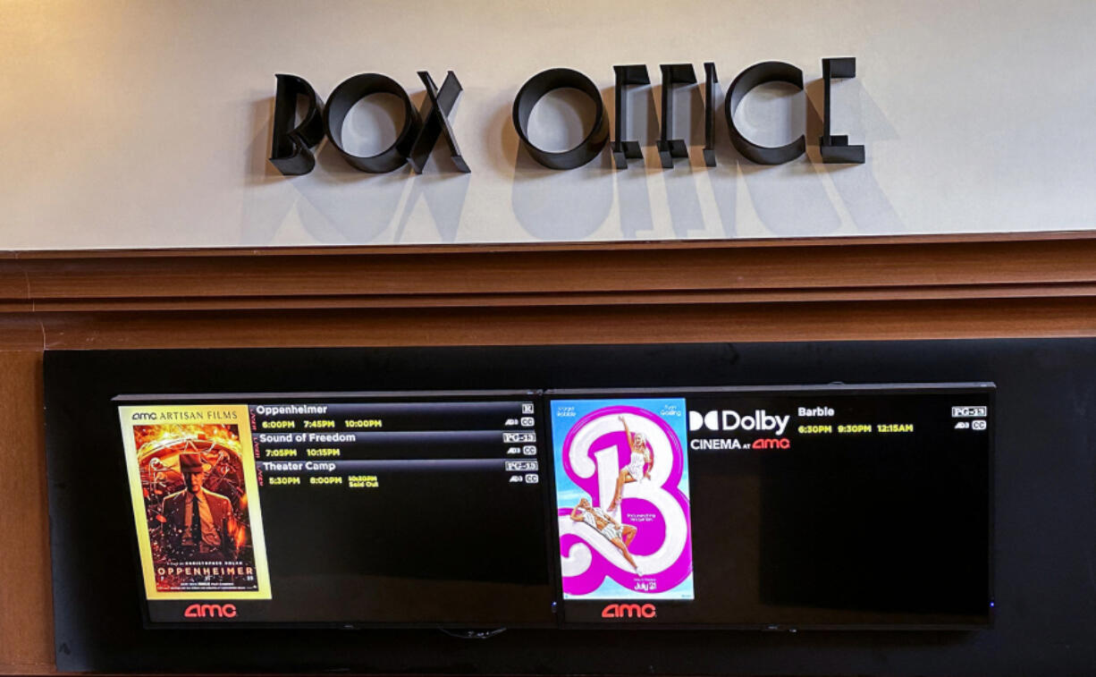 A movie theater box office is pictured announcing the opening of "Oppenheimer" and "Barbie" movies, in Los Angeles on July 20, 2023.