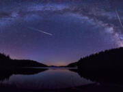 The Perseids in the night sky above the Beglik dam in Rhodopi Mountains, Bulgaria.