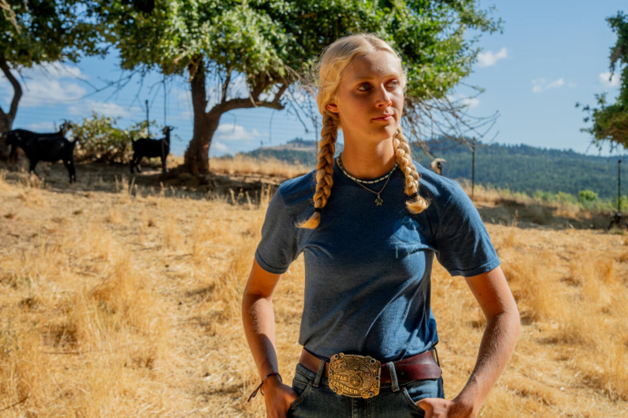 Sylvia Smith, 16, stands on the Melrose, Ore., ranch she uses to raise her ten goats. Sylvia started a YouTube channel right before the start of the pandemic in 2020 to document her journey.