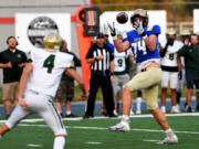 A big highlight from the 2022 season, Kelso's Payton Stewart intercepted this throw from Timberline quarterback Jacob Nadeau (4) and returned it 28 yards for a touchdown.