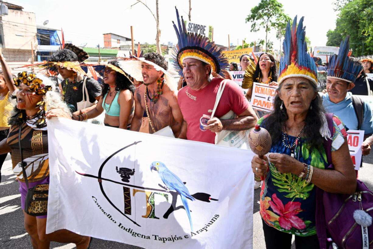 Indigenous people from Amazon countries and members of social movements take part in the March of the Peoples of the Earth for the Amazon in Bel?(C)m, Para State, Brazil, on Aug. 8, 2023.