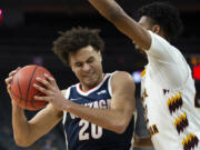 Gonzaga forward Kaden Perry (20) works against Central Michigan center Nicolas Pavrette during the second half of an NCAA college basketball game Monday, Nov. 22, 2021, in Las Vegas.