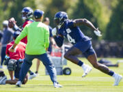 Seattle Seahawks wide receiver DK Metcalf (14) runs during the NFL football team's training camp, Thursday, Aug. 3, 2023, in Renton, Wash.