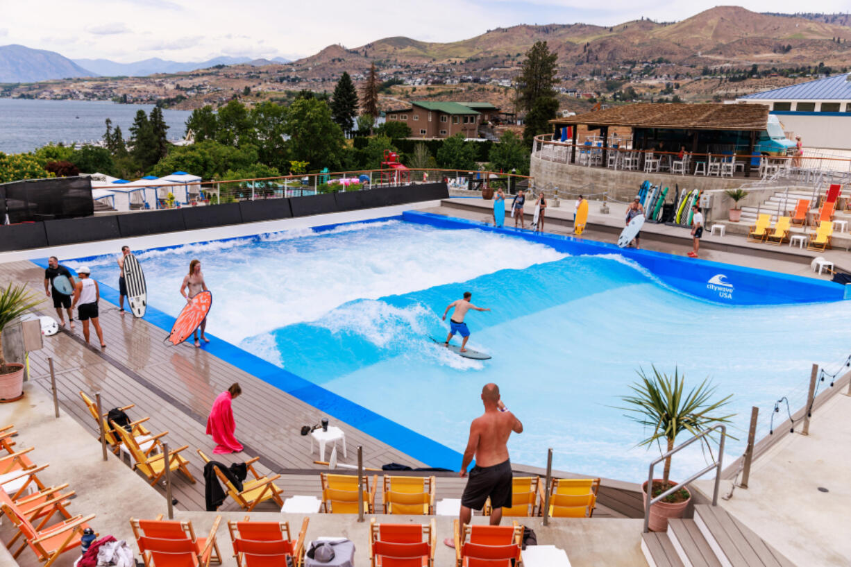 Brian Hitchens of Edmonds rides a wave at Lakeside Surf on June 13 in Chelan.