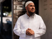 Imam Farid Sulayman stands for a portrait in Seattle's Rainier Valley neighborhood.